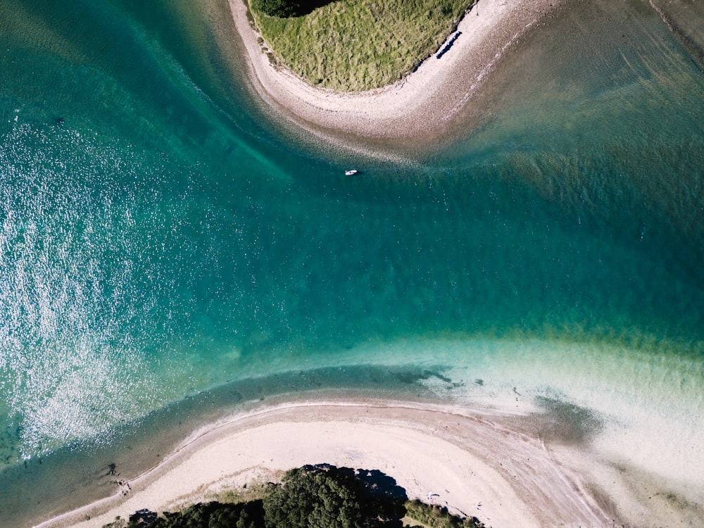 aerial photo of body of water between two islands