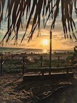 A retro-style poster showcasing Siesta Key’s iconic white sandy beach under a glowing sunset.
