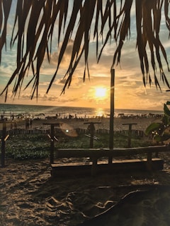 A retro-style poster showcasing Siesta Key’s iconic white sandy beach under a glowing sunset.