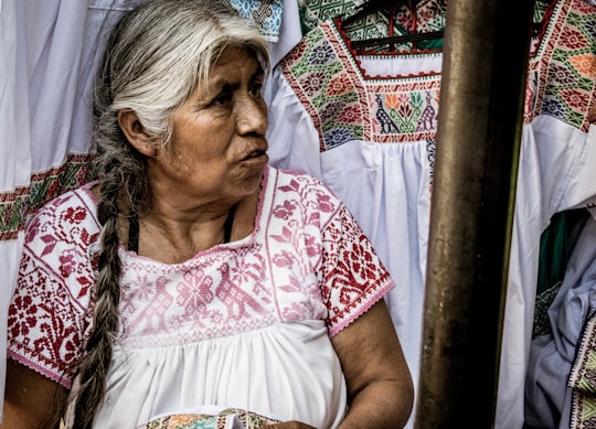 woman in white and red short-sleeved dress in Cuetzalan del Progreso Mexico