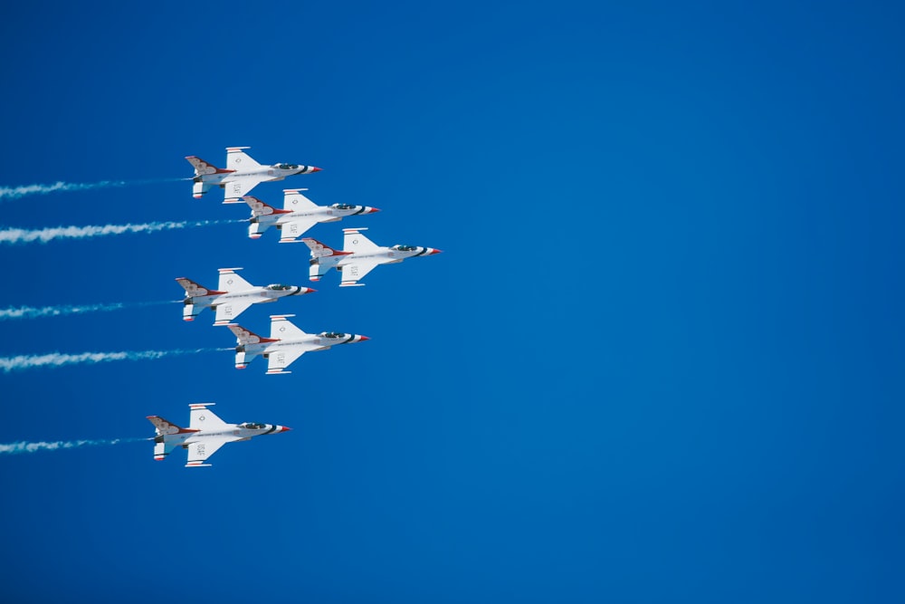 time lapse photography of five jet planes