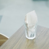 tissue paper inside clear drinking glass