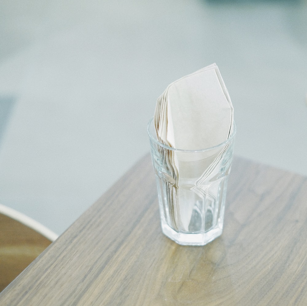 tissue paper inside clear drinking glass