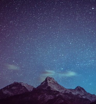 icy mountains under starry night