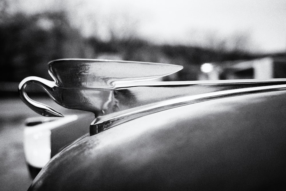 a close up of a metal object on a car