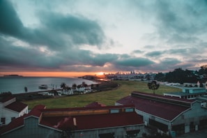 A panoramic view of Karachi's coastline under a dramatic sunset.