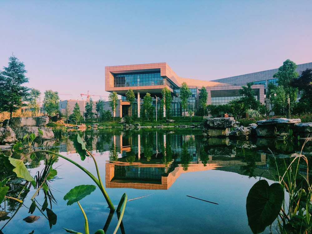 panorama photography of beige concrete building near body of water at daytime