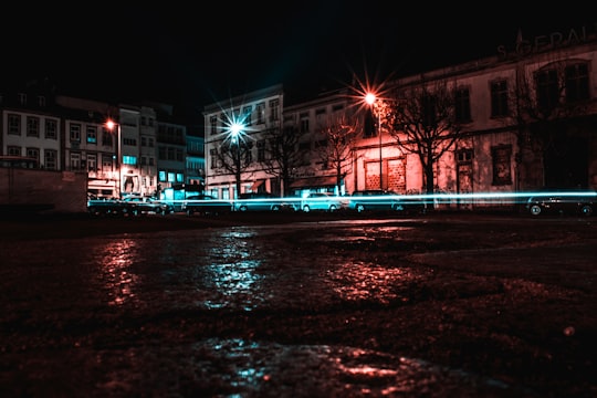 time lapse photography of car parked beside building in Largo Carlos Amarante Portugal