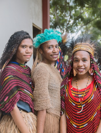 three women wearing seagrass skirts