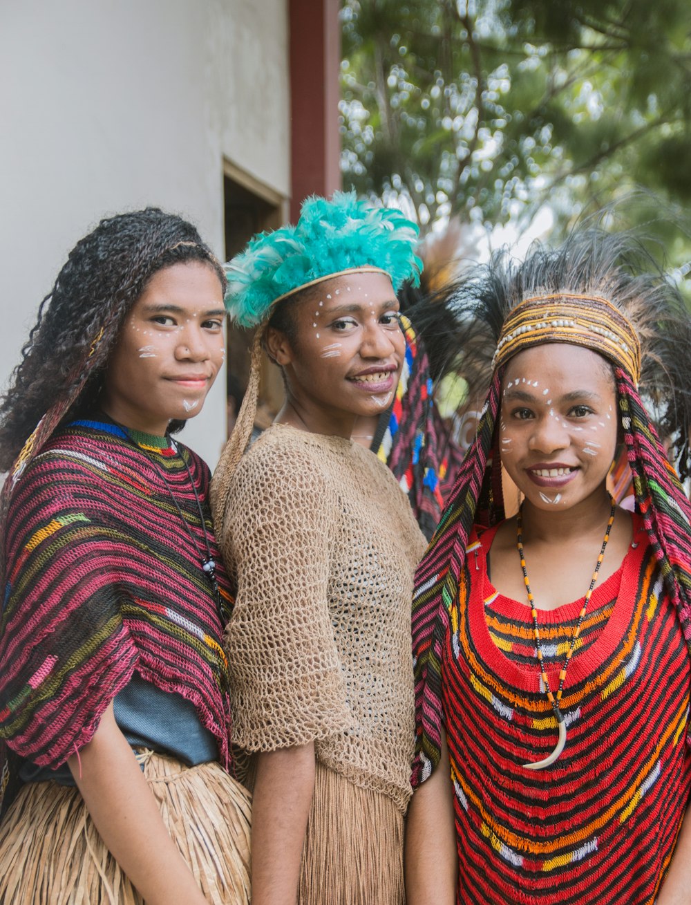 three women wearing seagrass skirts