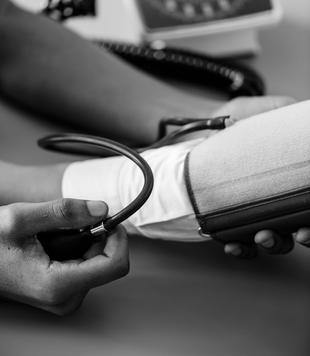 person taking blood pressure monitor