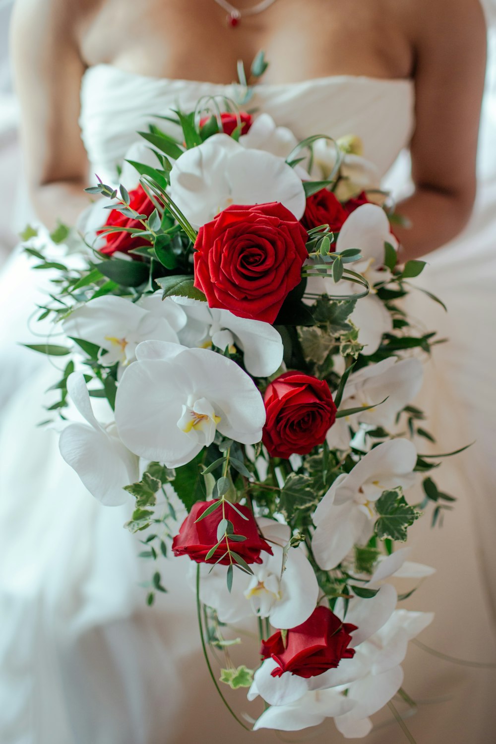 red rose and white orchid bouquet