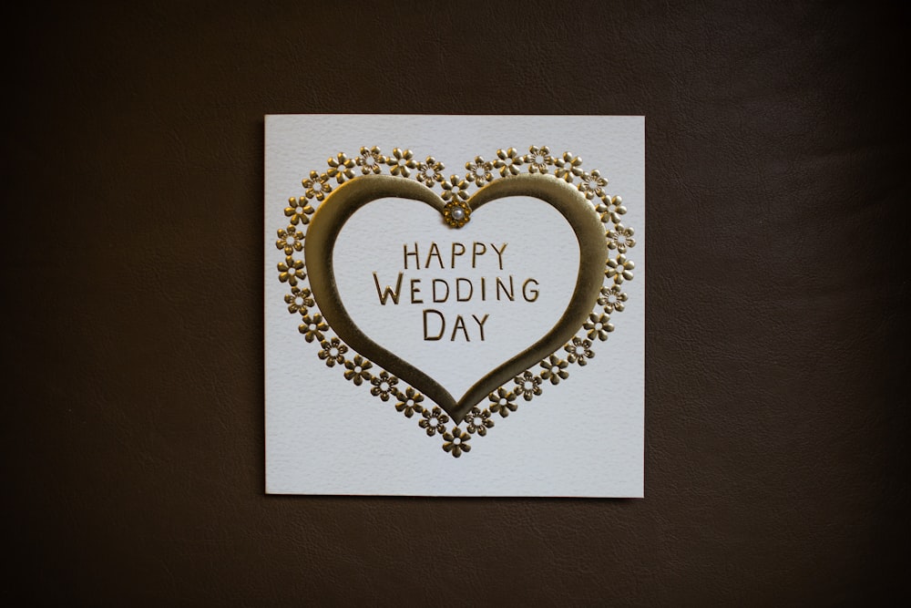 white happy wedding day card on brown surface