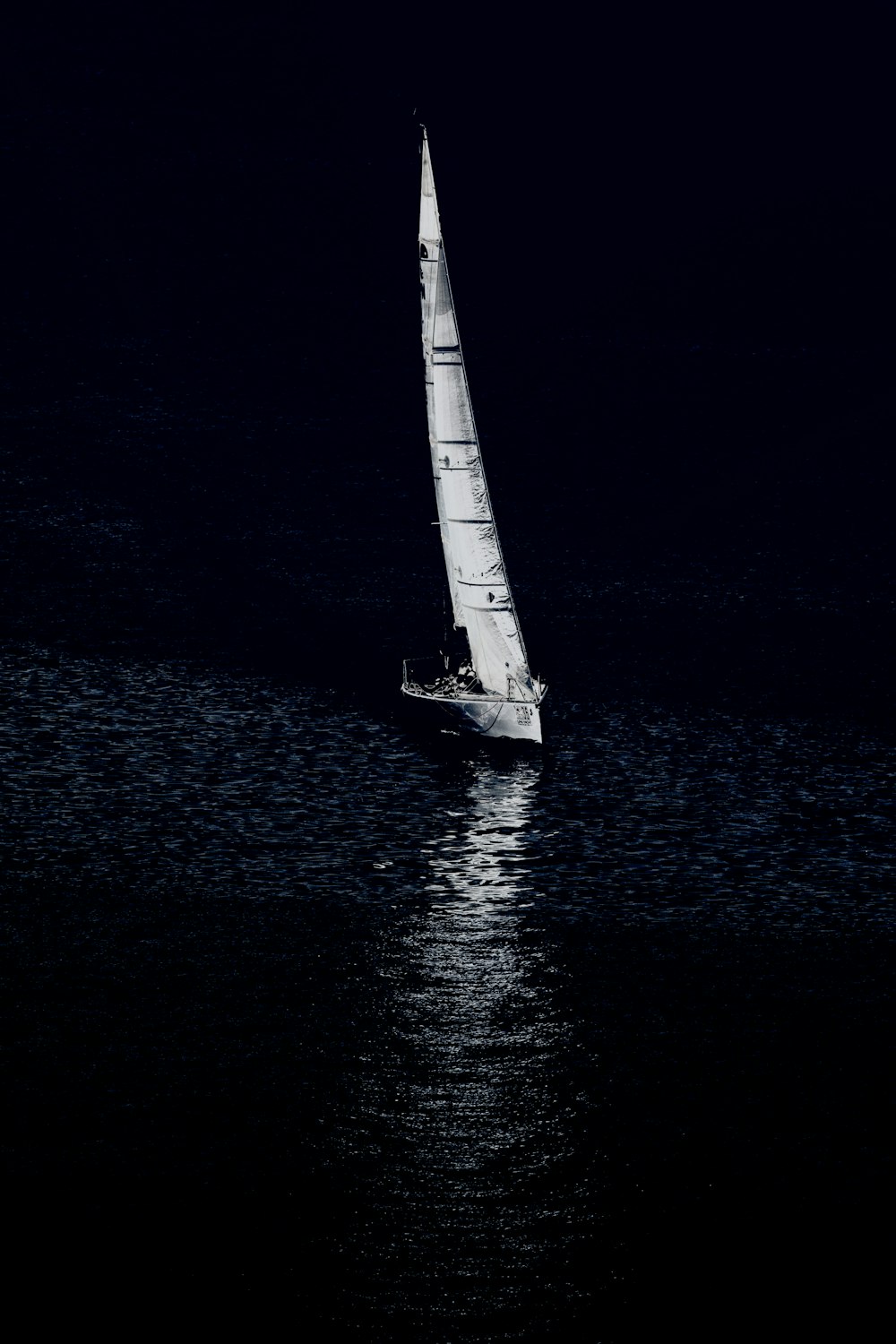 white sailboat on body of water