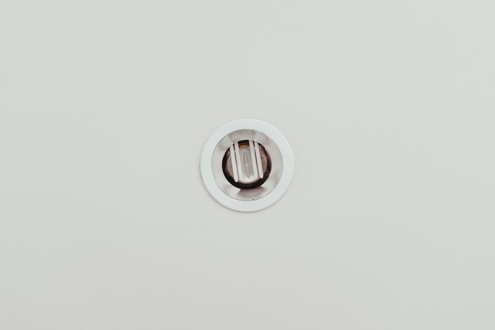a white wall with a round hole in the middle