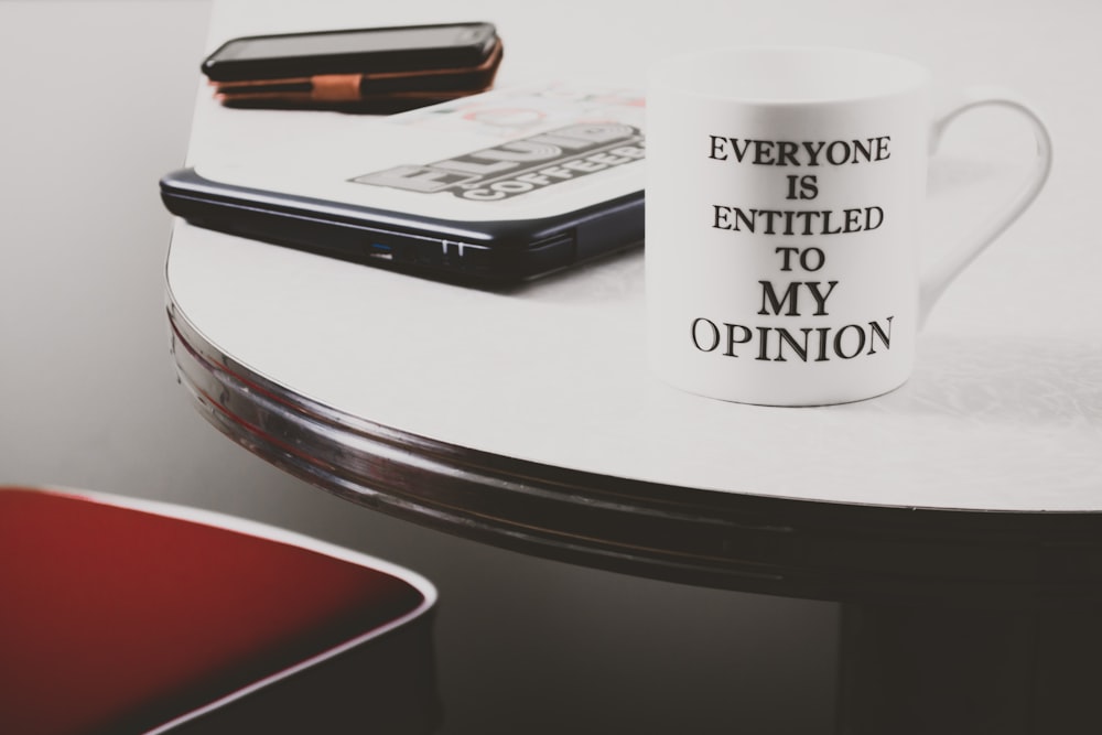 white ceramic mug on table