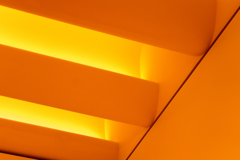 a close up of a ceiling with yellow lights