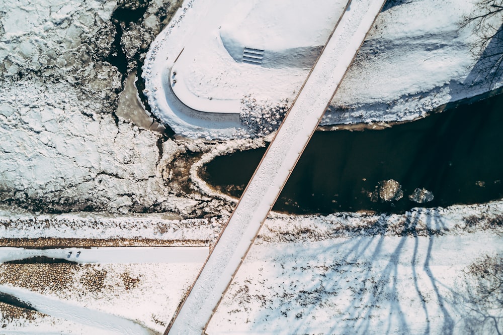 an aerial view of a snow covered road