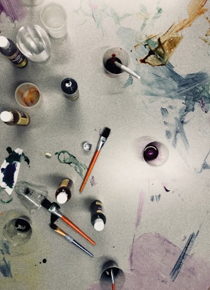 paint brush beside cup