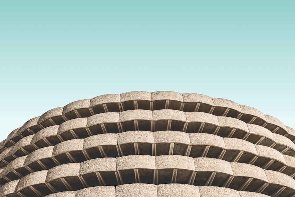 low angle photo of brown concrete building