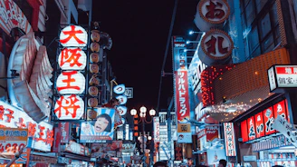 Colorful LED sign with dynamic lighting effects on a busy street.