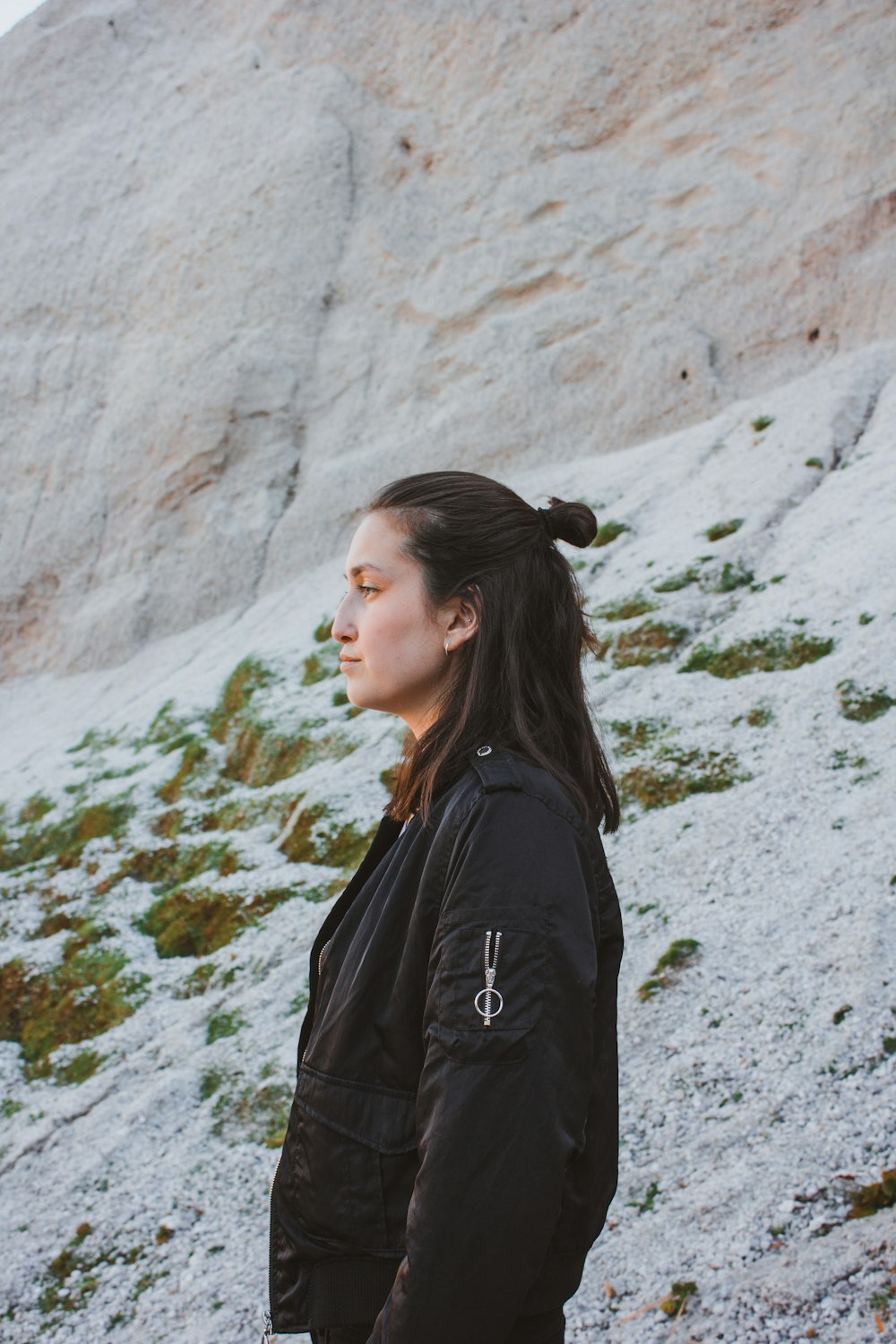 woman standing near cliff at daytime