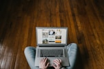 person using laptop on lap