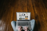 person using laptop on lap