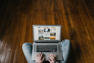 person using laptop on lap