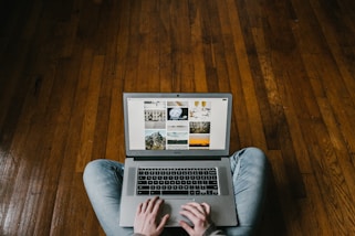 person using laptop on lap
