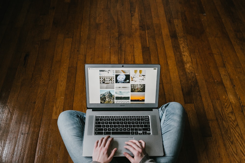 person using laptop on lap