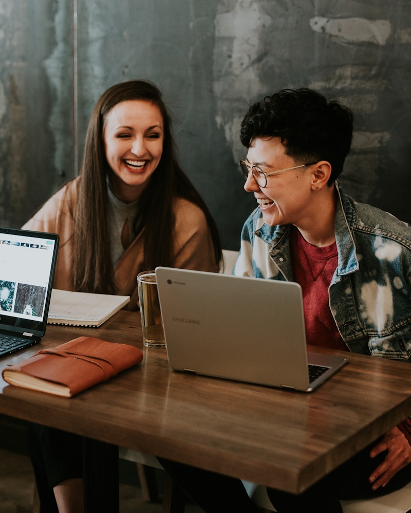 Diverse group of people laughing and learning together