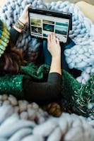 woman using black Samsung tablet computer