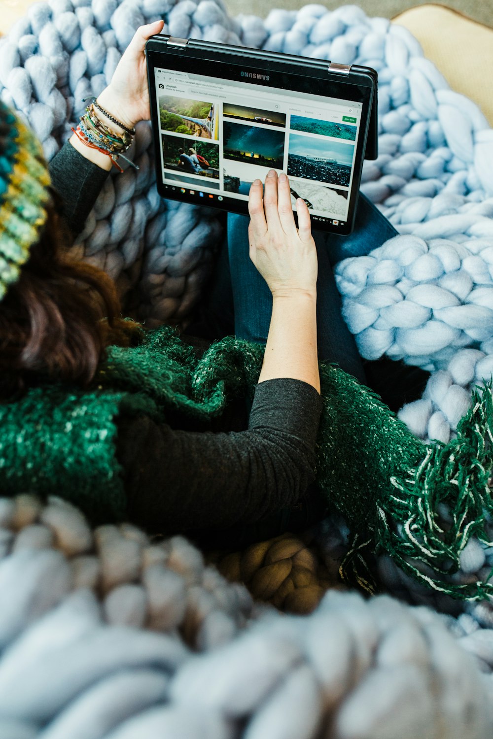 woman using black Samsung tablet computer