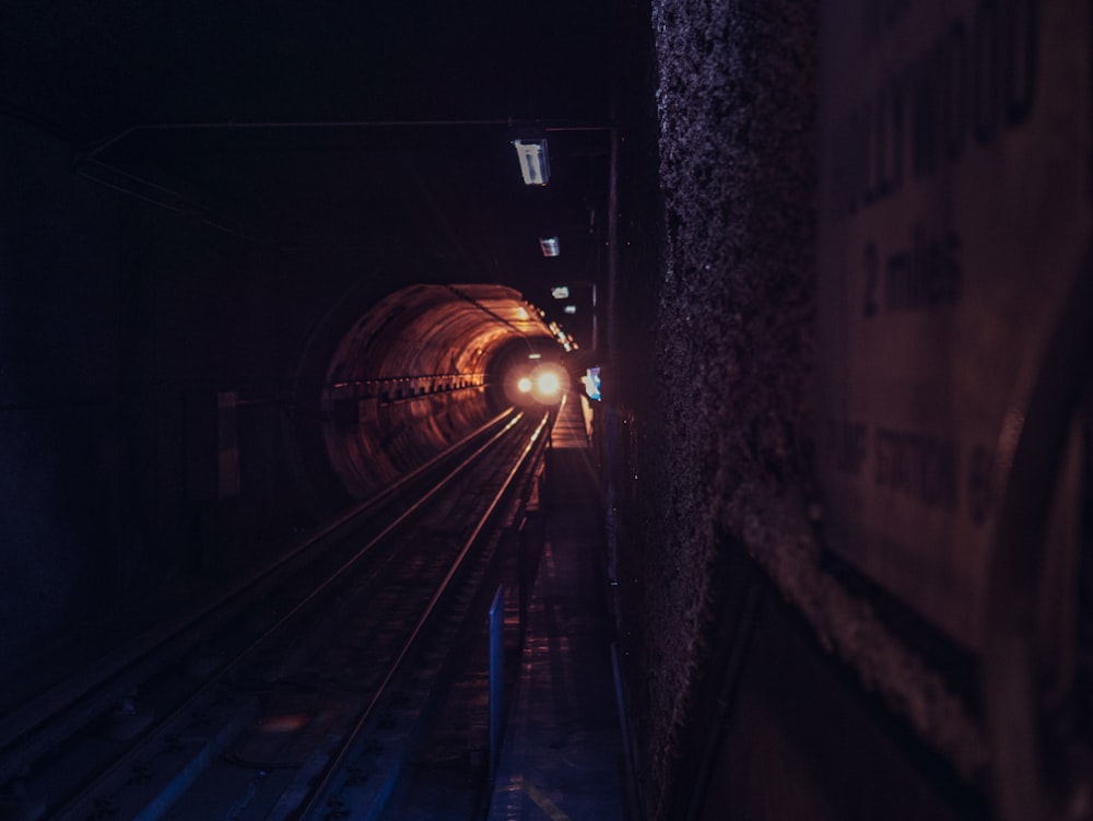 gray concrete tunnel with narrow pathway