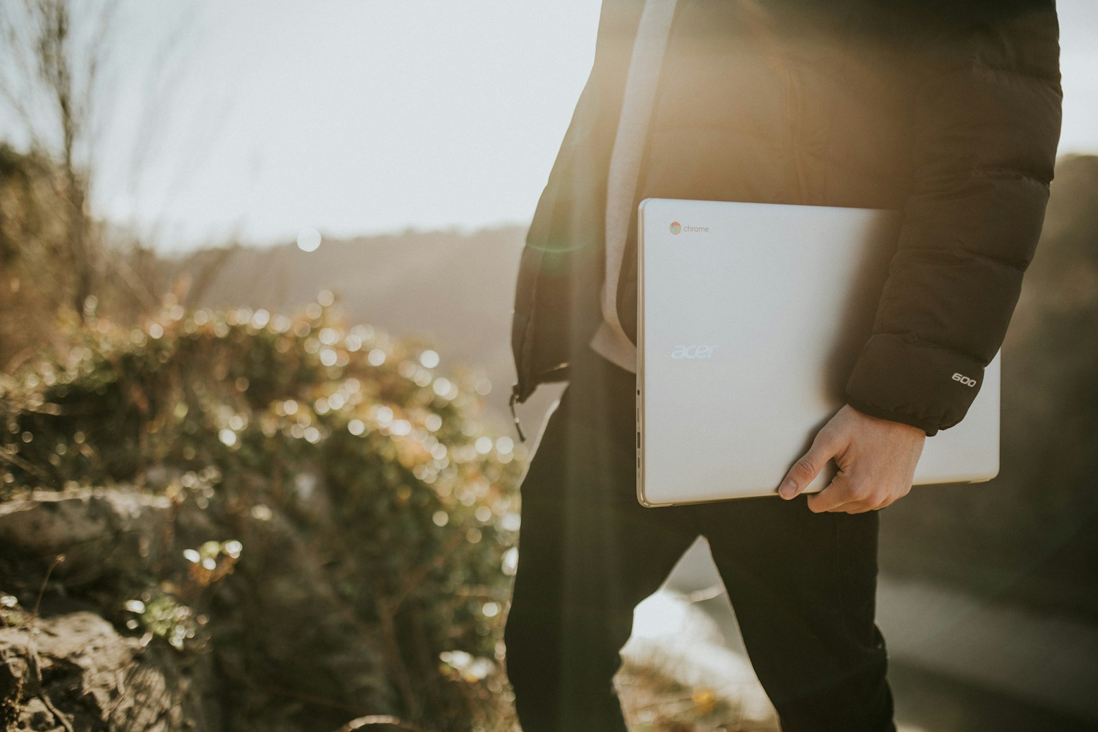 Laptop and phone showing video editing workspace for AI UGC