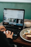 person holding black Samsung laptop