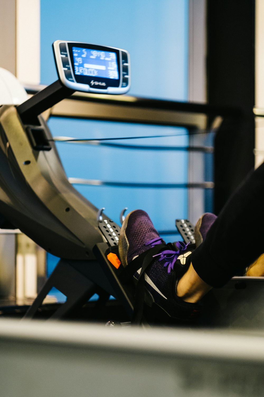 person on gym equipment exercising