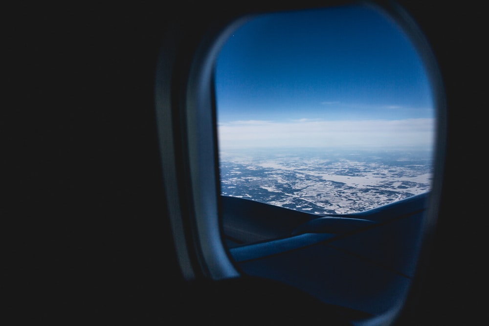 selective focus photography of airplane window