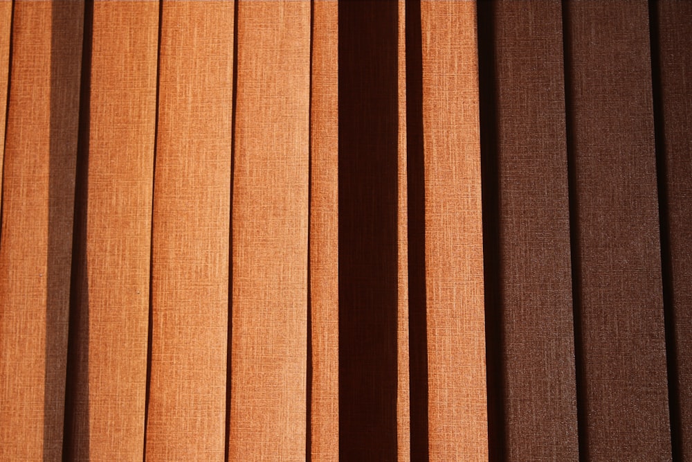 a close up of a window with brown blinds
