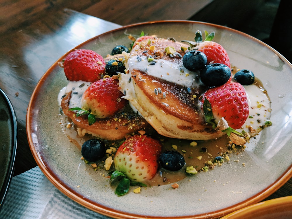 two pancakes on white plate