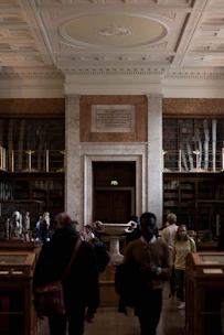 Guests enjoying a guided tour through the mansion’s ornate rooms, with a knowledgeable guide sharing stories.