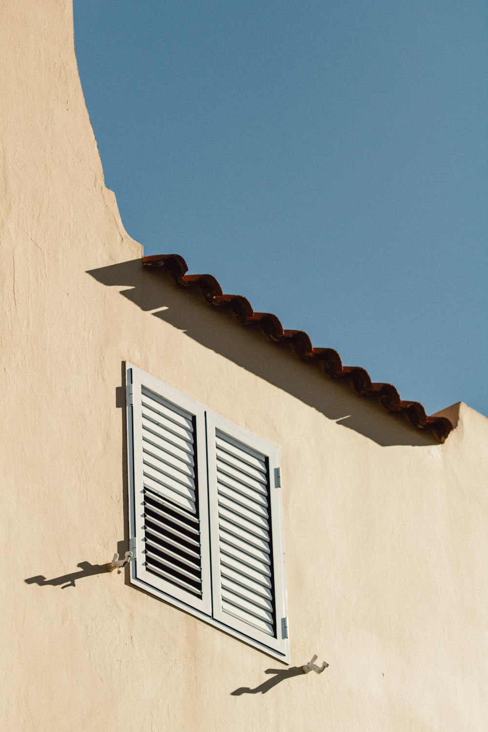 closed white louvered windows