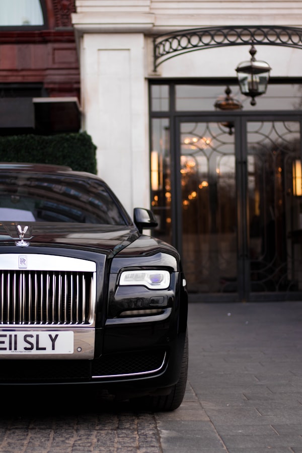 Dark luxury coupe in a city setting
