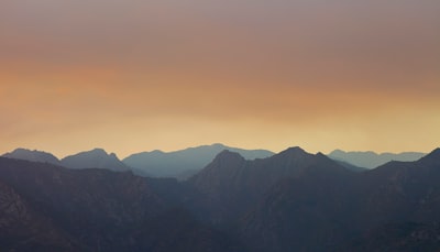 silhouette of mountains during sunset sublime zoom background