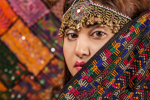 woman covered by multicolored scarf