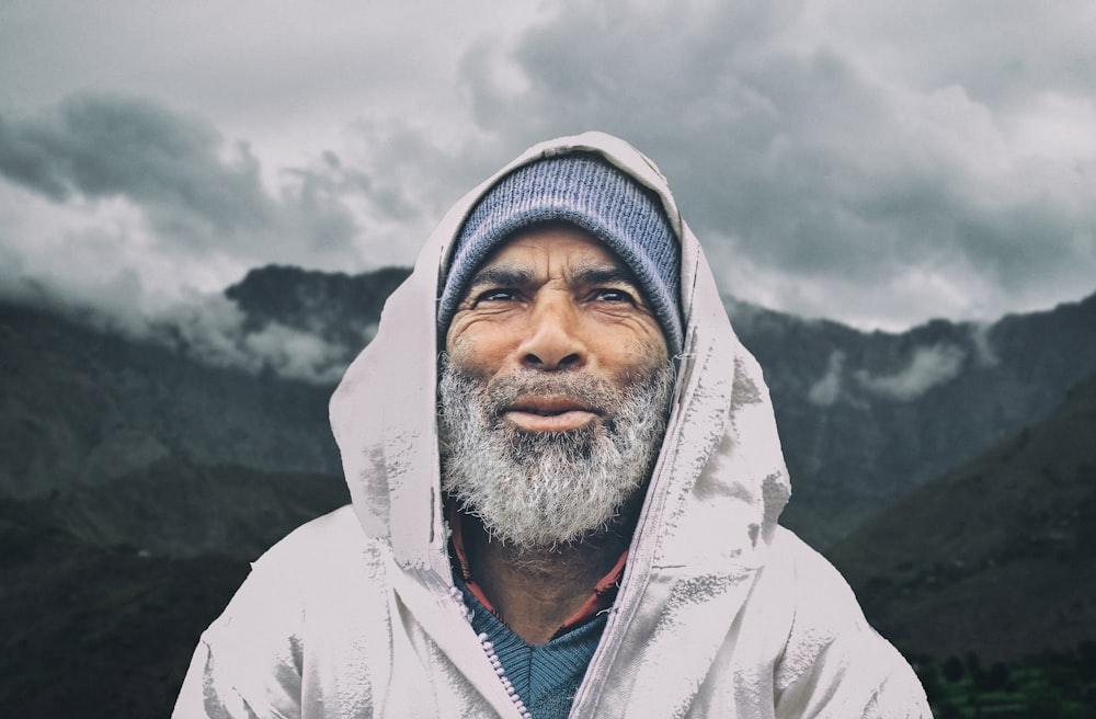 man wearing hooded jacket