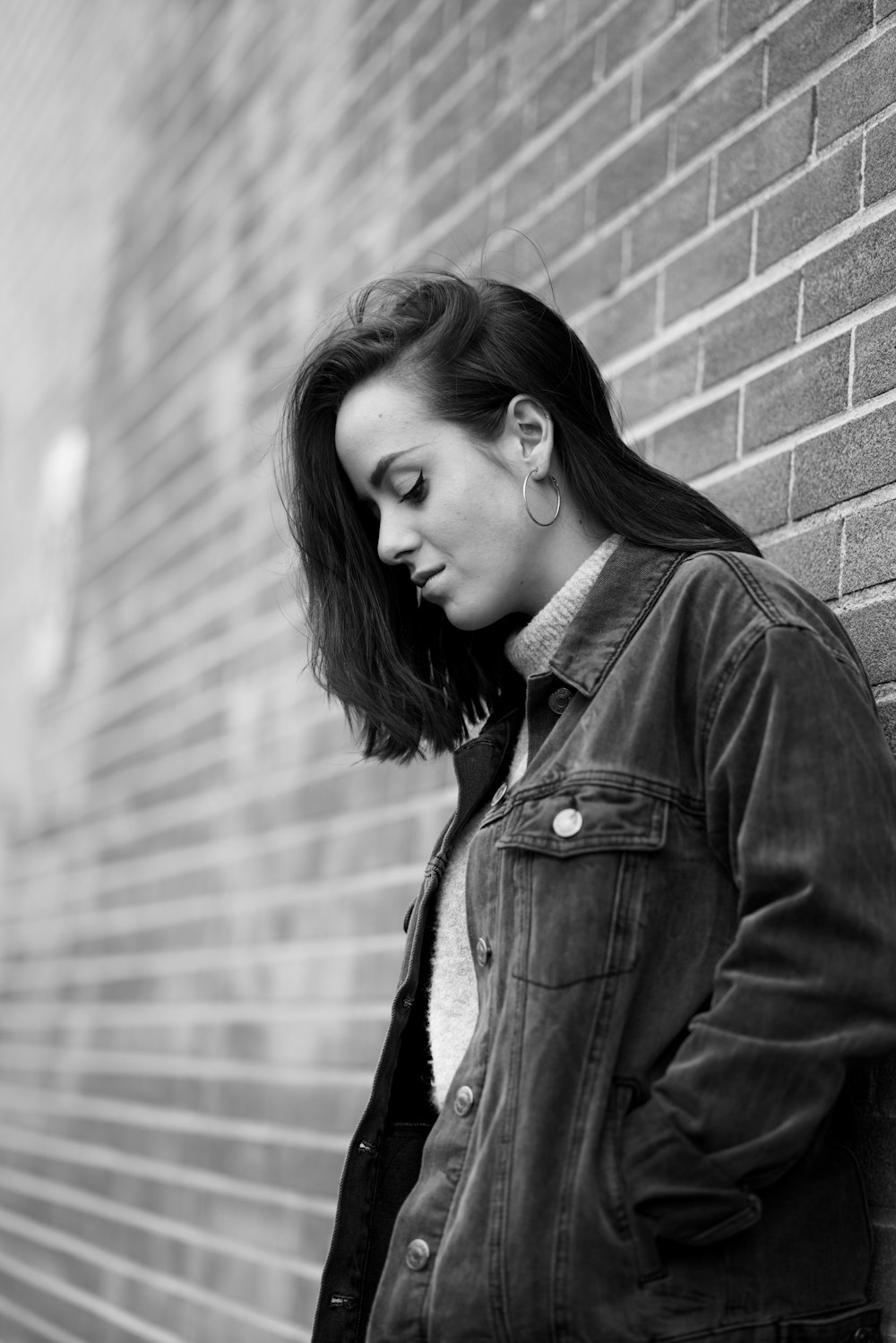 woman leaning on wall