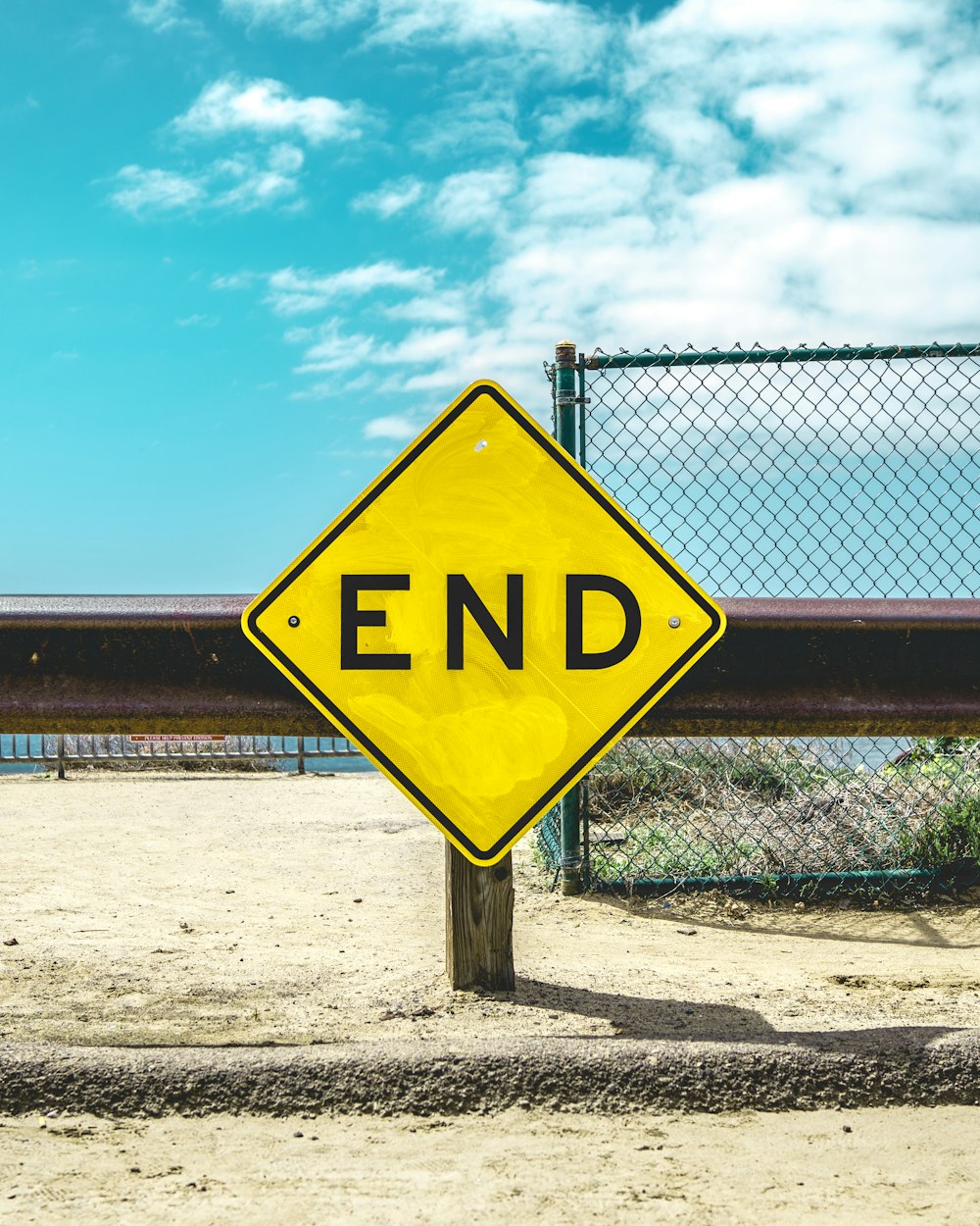 End sign on beige sand