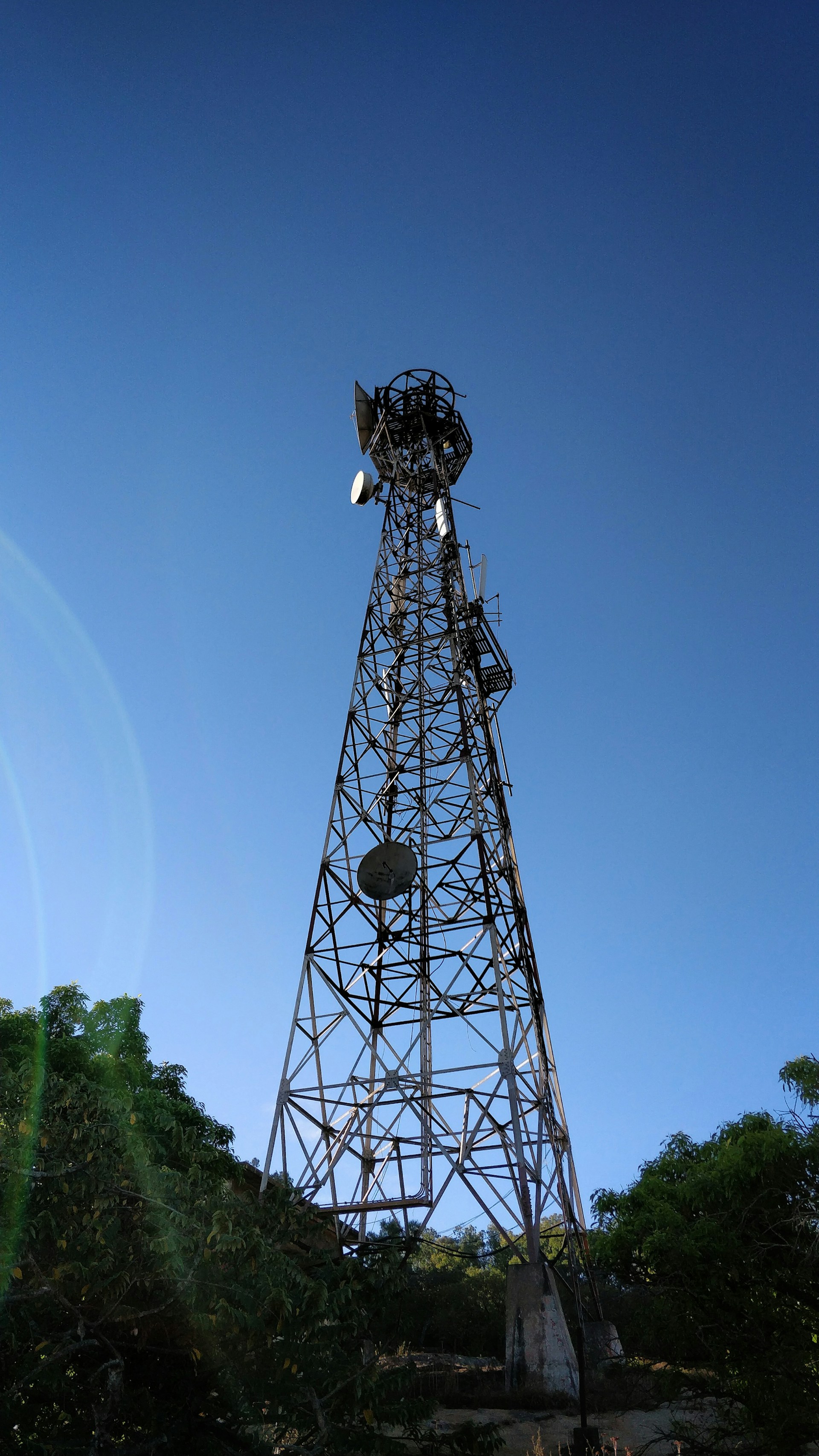 woman wearing yellow long-sleeved dress under white clouds and blue sky during daytime